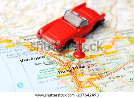 Close up of  Pisa  , Italy map with red pin and a car   - Travel concept
