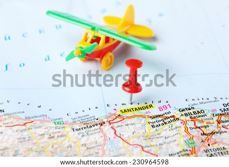 Close up of Santander   ,Spain  map airplane toy   and red pin - Travel concept