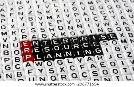 ERP Enterprise Resource Planning writen on black and white dices
