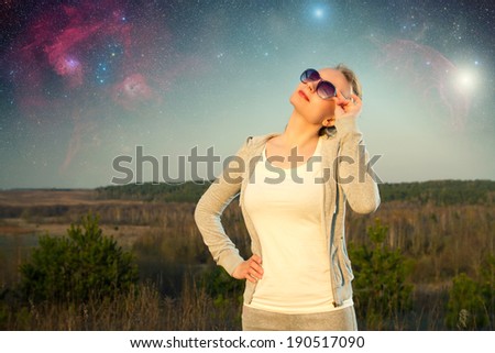 girl and a starry sky. Elements of this image furnished by NASA