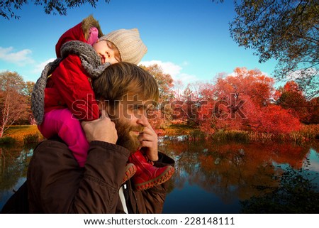 Dad and daughter. daughter fell asleep on his neck with his father in autumn park