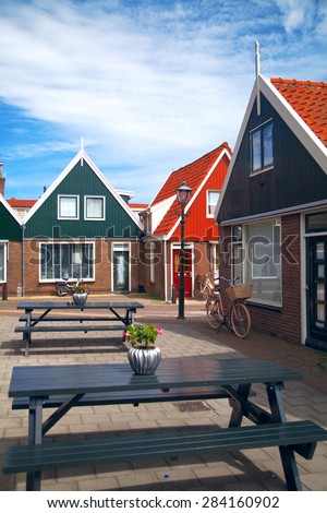 Vintage Dutch town of Volendam European evening. Retro style. houses and bikes on the street in the summer