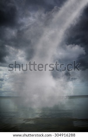 Bad weather and the storm with the wind on the sea. tornado over the ocean