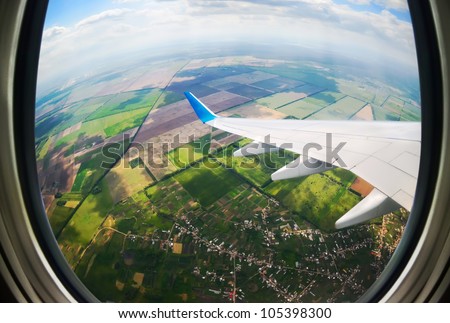 earth and plane wing view from an illuminator