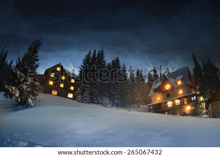 Wooden houses in winter forest, Dragobrat in Ukraine