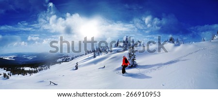 Skier skiing downhill in high mountains against sunset,Dragobrat,Ukraine