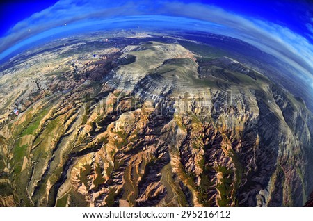 Natural landscape with ancient colorful sandstone formations in rocky mountains of Cappadocia, Turkey