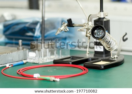 photo of electronics equipment assembly workplace with necessary tools