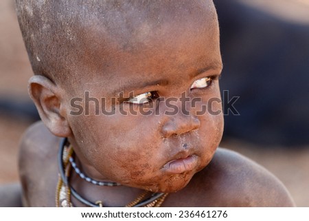 NAMIBIA, KAMANJAB, OCTOBER 10: Unidentified child Himba tribe. The Himba are indigenous peoples living in northern Namibia, in the Kunene region of South-West Africa on october 10 2014
