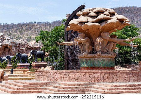 Gigantic monkey and elephant statues on fountain near bridge in famous Lost City in Sun City, South Africa.