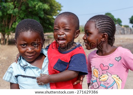 NAMIBIA, KAVANGO, OCTOBER 15: unidentified dirty and poor Namibian children near town Rundu, Kavango with the highest poverty level in Namibia. October 15, 2014, Namibia