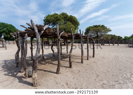Traditional african village with housed and wooden fence in Namibia, near town Kavango in region with the highest poverty level in Namibia