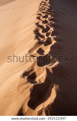human footprints on dune in Hidden Vlei in Namib desert, best place of Namibia