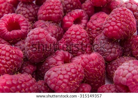 Raspberries background red berry texture pattern