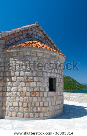 Mediterranean house with orange tile against deep blue sky