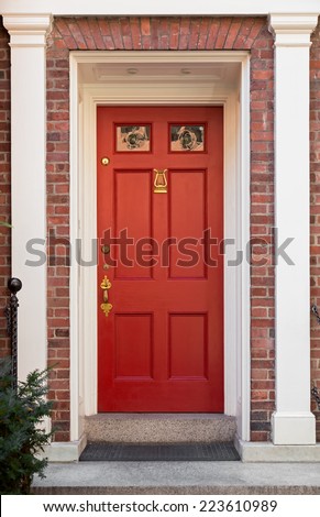 Red Front Door with White Columns and Door Frame