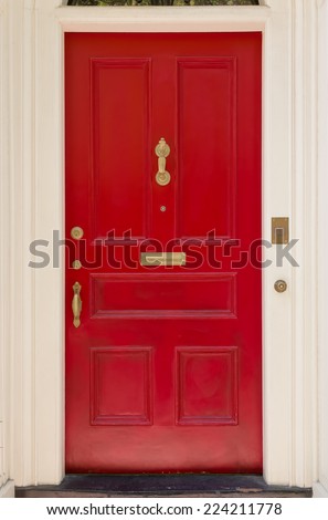 Close-Up of Red Front Door with White Archway Door Frame
