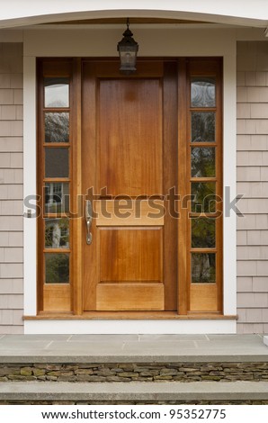 Front door showing hanging light fixture
