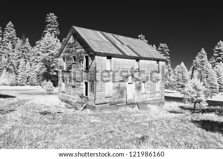 A ghostly old bunkhouse at the head of an abandoned cinnabar mine in the Ochoco Mountains in central Oregon. (Taken with a camera converted to infrared.)