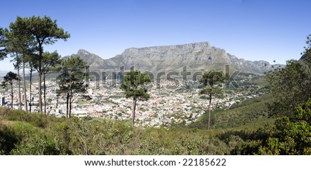 A panorama view of Table Mountain from the park at the top of Signal Hill. This image looks out over the city of Cape Town in South Africa.