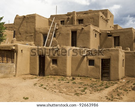 TAOS, NEW MEXICO - SEPTEMBER 7: The historic Taos Pueblo on September 7, 2011 is in Taos, New Mexico. The adobe walls of mud and straw are typical of native American culture in the region.