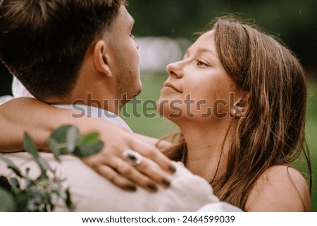 Similar – Image, Stock Photo Tender couple looking to camera in nature