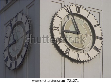 An old clocktower face tells time.