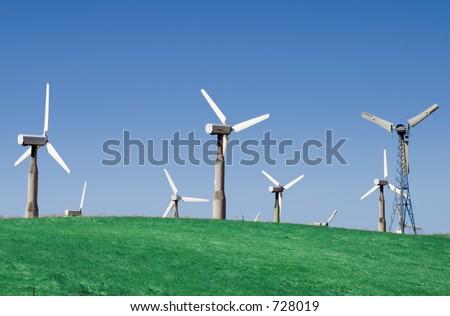 A group of windmills on rolling hills in California.