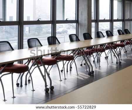 meeting room with a long table next the window