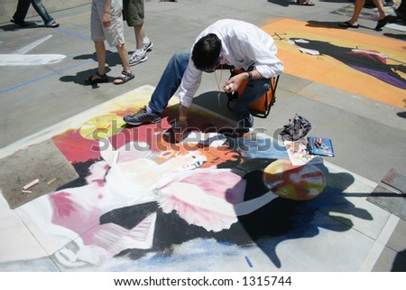 Man Illustrating in Chalk