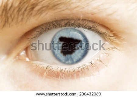 A close-up of an eye with the pupil in the shape of Spain.(series)