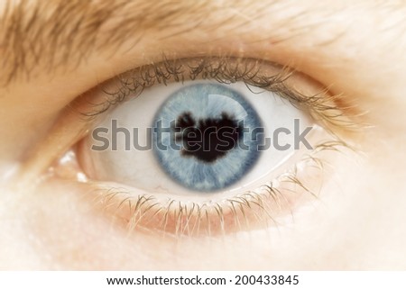 A close-up of an eye with the pupil in the shape of Iceland.(series)