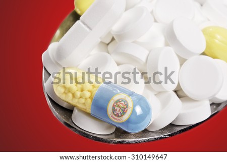 The national flag of Minnesota on a capsule and pills on a spoon.(series)