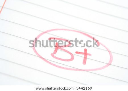 Teachers marking in red pen