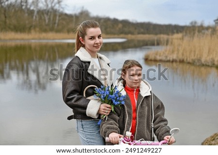 Similar – Image, Stock Photo Child picking spring flowers