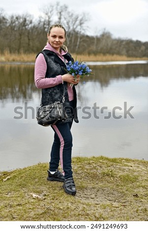 Similar – Image, Stock Photo Child picking spring flowers