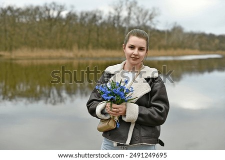 Similar – Image, Stock Photo Child picking spring flowers