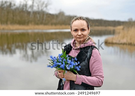 Similar – Image, Stock Photo Child picking spring flowers