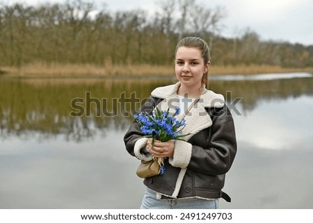 Similar – Image, Stock Photo Child picking spring flowers