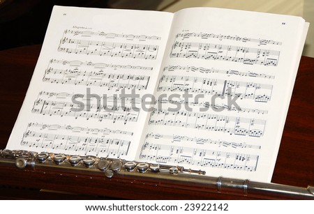 Sheet of Music and Flute