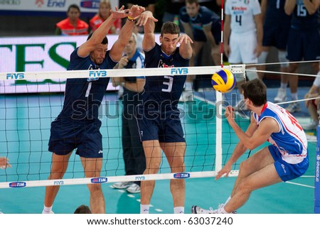 ROME, ITALY - OCTOBER 10: Serbia Milos Nikic spikes ball at Volleyball World Championships bronze medal match Italy vs Serbia at Palalottomatica in Rome on October 10, 2010