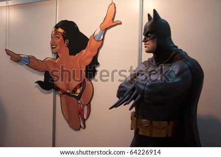 LUCCA, ITALY - OCTOBER 30: Batman and Wonder Woman at DC comics stand at Lucca Comicgs and Games 2010 fair on October 30, 2010 in Lucca, Italy.