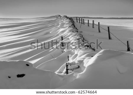 Patterns made by drifting snow in landscape