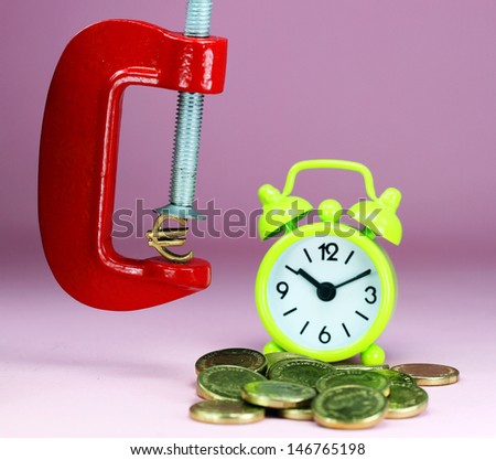A Gold Euro Symbol in a red vice, with a green clock resting on some gold coins with a pastel purple background, asking the question how far will the Euro be squeezed.