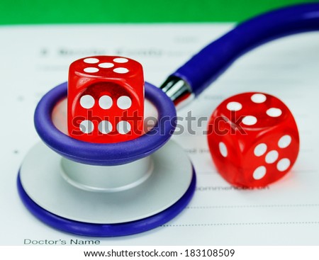 A Doctors dark blue colored stethoscope with a red dice resting on the top of it and one on the pad, both resting on a doctors sick certificate pad, asking the question do you gamble with your health.