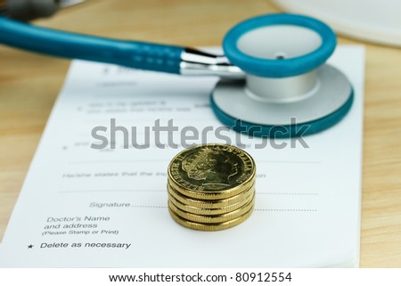 A doctor’s desk showing a teal colored stethoscope, stack of gold coins and sick certificate pad, suggesting the price of keeping healthy is rising.