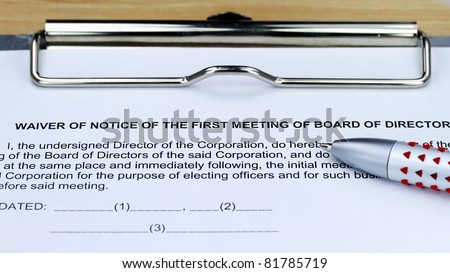 A ball point pen on a metal clipboard along with  a medical consent form for a minor, for you to sign.
