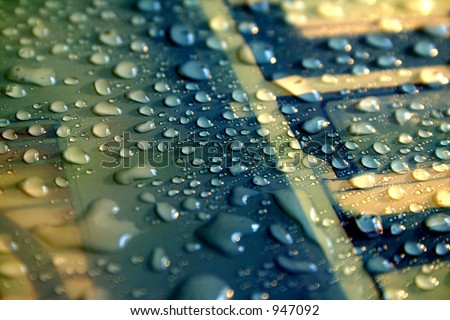 Droplets of water on a mouse pad.