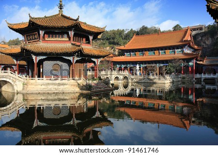 In the courtyard of Yuantong temple in Kunming, China, with the main worship hall in the background.