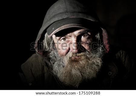 Old homeless man on the city
